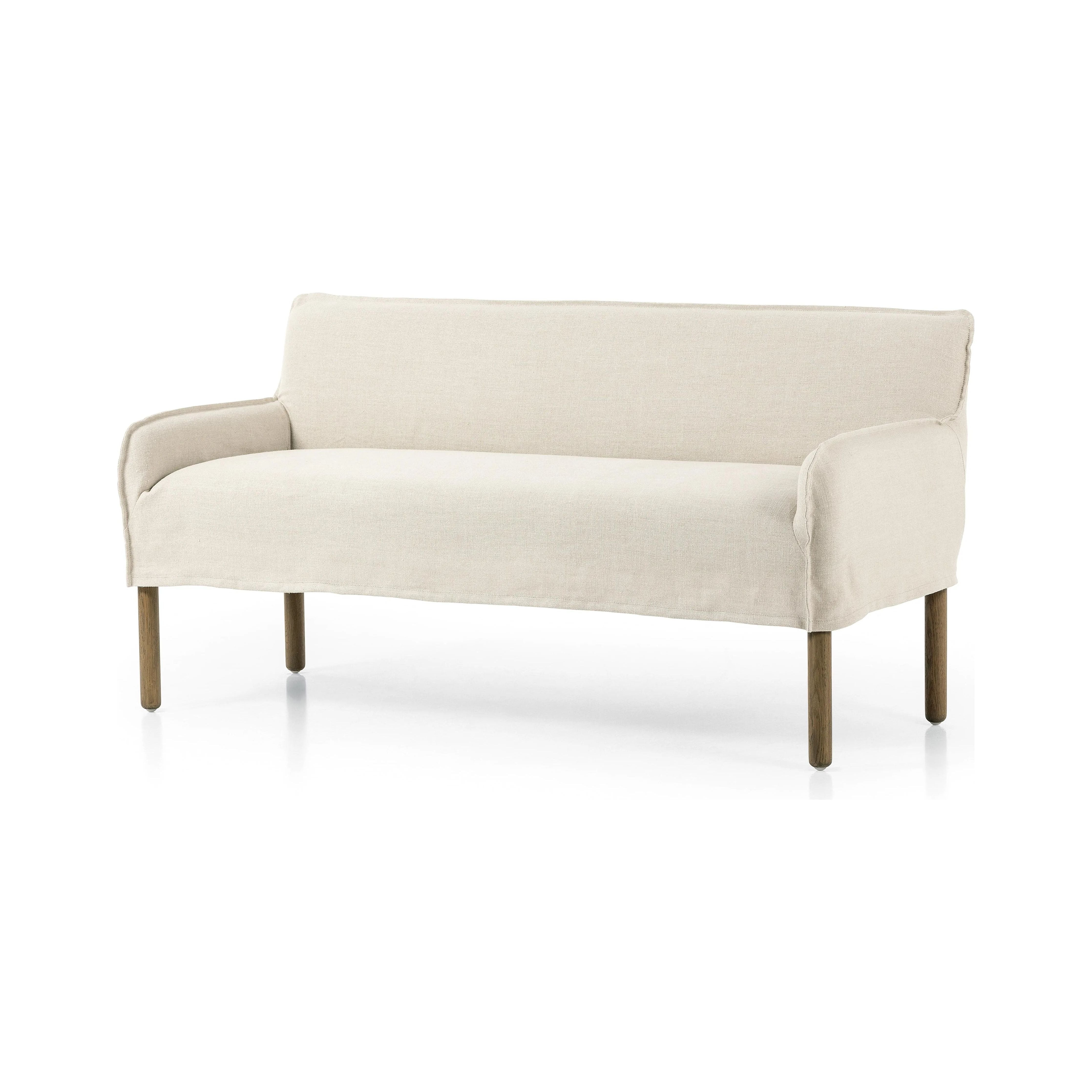 Featuring Addington Brussels Natural Slipcover Bench by Four Hands at Amethyst Home. Introducing a sustainable take on slipcovered seating. A relaxed dining bench is upholstered in soft, sustainably made Belgian Linen™, with solid oak legs. Libeco™-sourced Belgian linens are 100% natural and free of toxic chemicals. Certified Oeko-Tex® STANDARD 100, s. Amethyst Home provides interior design, new home construction design consulting, vintage area rugs, and lighting in the Alpharetta metro area.