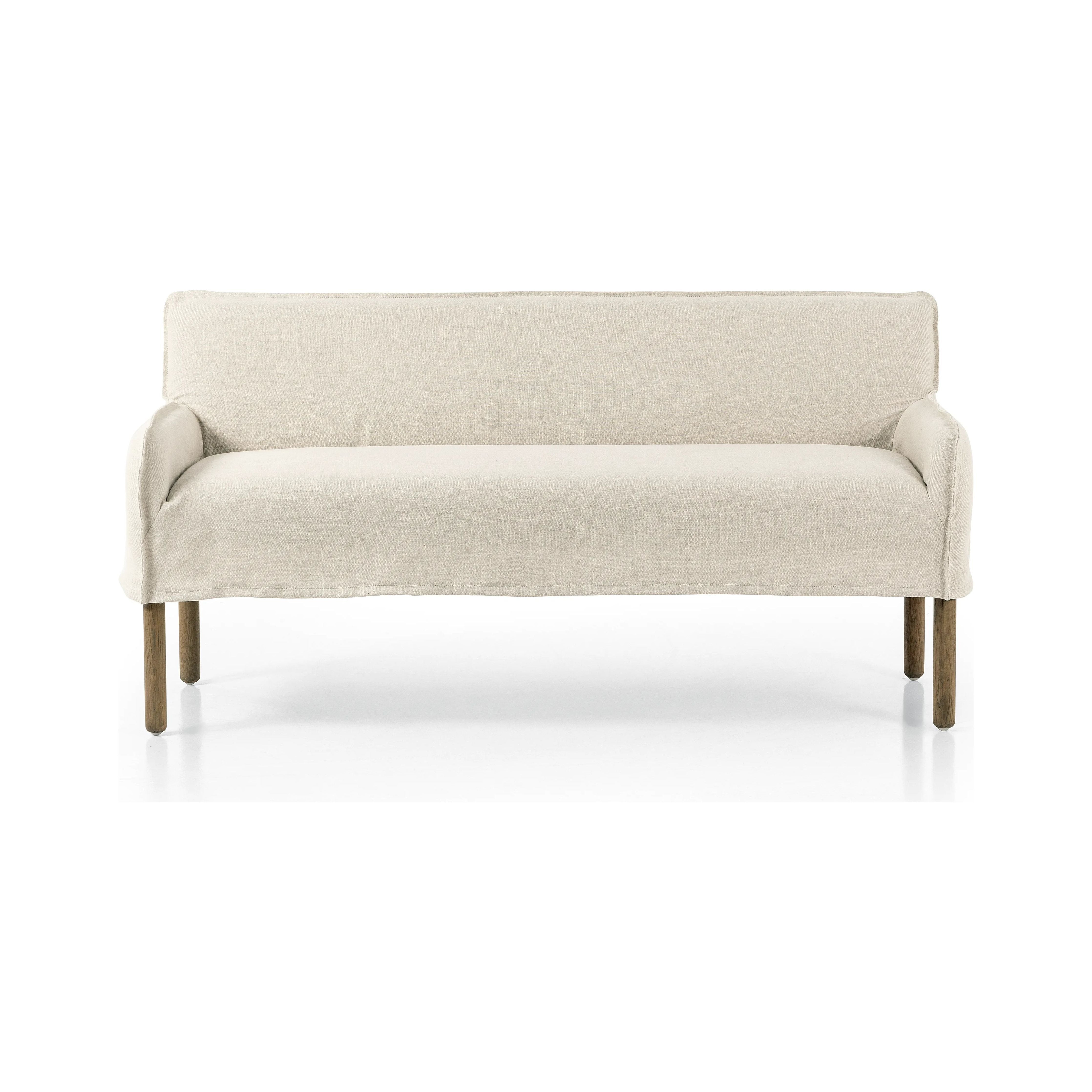 Featuring Addington Brussels Natural Slipcover Bench by Four Hands at Amethyst Home. Introducing a sustainable take on slipcovered seating. A relaxed dining bench is upholstered in soft, sustainably made Belgian Linen™, with solid oak legs. Libeco™-sourced Belgian linens are 100% natural and free of toxic chemicals. Certified Oeko-Tex® STANDARD 100, s. Amethyst Home provides interior design, new home construction design consulting, vintage area rugs, and lighting in the Des Moines metro area.