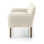 Featuring Addington Brussels Natural Slipcover Bench by Four Hands at Amethyst Home. Introducing a sustainable take on slipcovered seating. A relaxed dining bench is upholstered in soft, sustainably made Belgian Linen™, with solid oak legs. Libeco™-sourced Belgian linens are 100% natural and free of toxic chemicals. Certified Oeko-Tex® STANDARD 100, slip. Amethyst Home provides interior design, new home construction design consulting, vintage area rugs, and lighting in the Houston metro area.