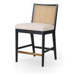 Featuring Antonia  Armless Dining Stool Stool by Four Hands at Amethyst Home. Light-toasted parawood frames a textural inlay of natural cane for a clean, monochromatic look, with seating of performance fabric for smart sensibility. Perfectly sized for the counter, with a brass kick plate for comfort and contrast. Performance fabrics are specially created to withstand spills, stains,. Amethyst Home provides interior design, new construction, custom furniture, and area rugs in the Boston metro area.