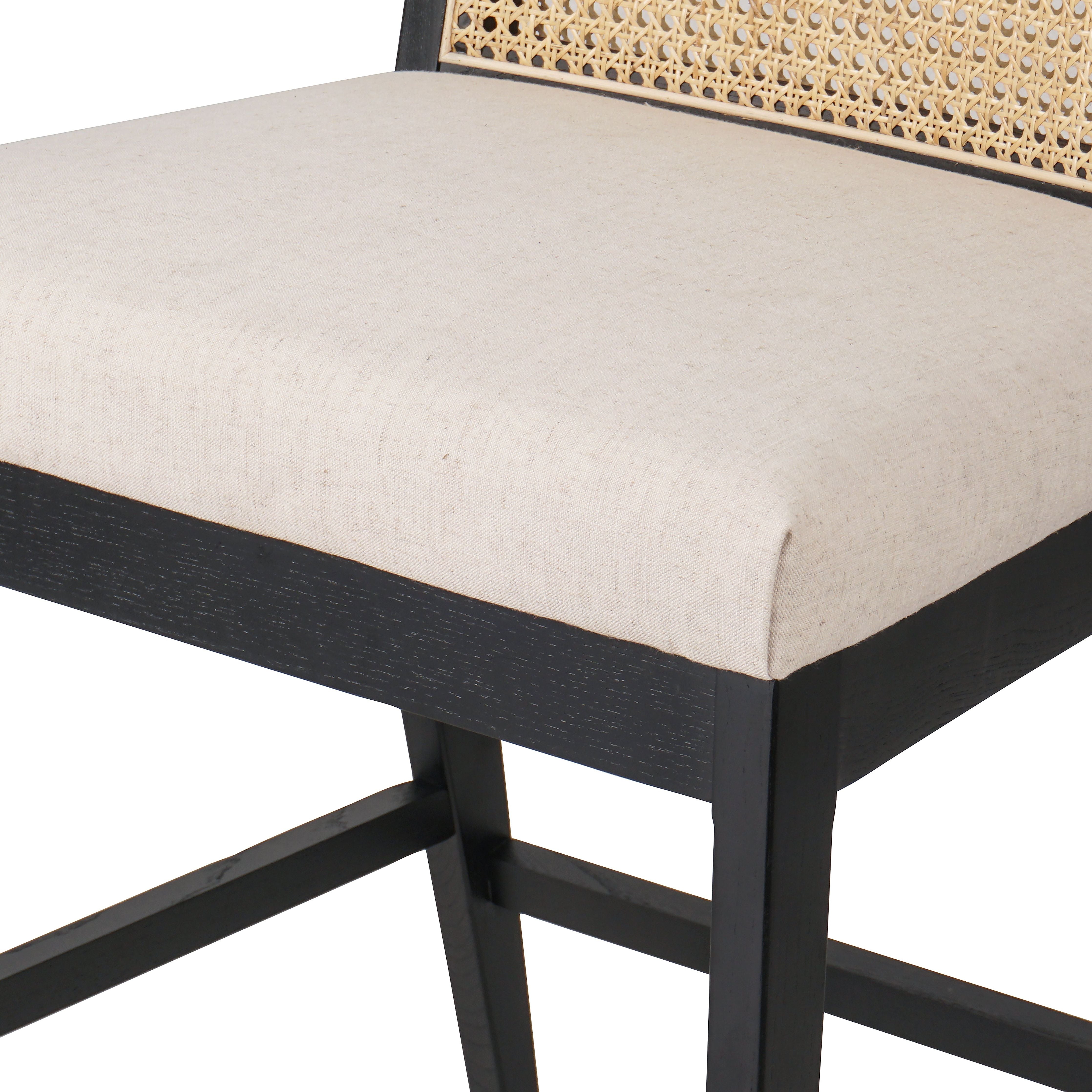 Featuring Antonia  Armless Dining Stool Stool by Four Hands at Amethyst Home. Light-toasted parawood frames a textural inlay of natural cane for a clean, monochromatic look, with seating of performance fabric for smart sensibility. Perfectly sized for the counter, with a brass kick plate for comfort and contrast. Performance fabrics are specially created to withstand spills, stain. Amethyst Home provides interior design, new construction, custom furniture, and area rugs in the Portland metro area.