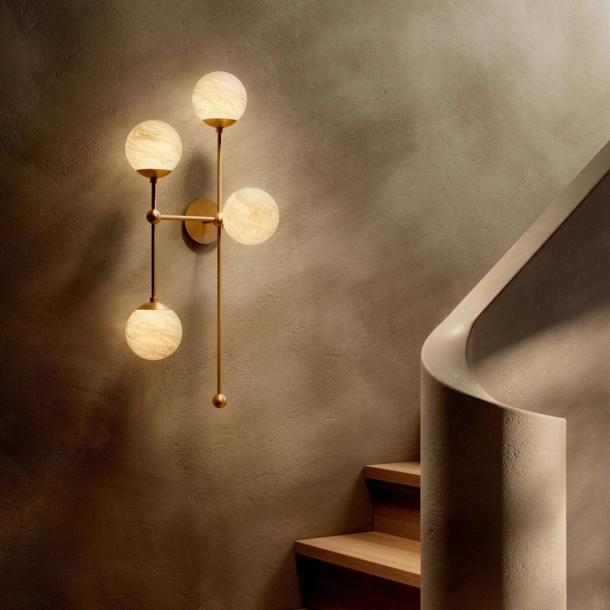 Featuring Armstrong Burnished Brass Marbled Matte Glass 4 L Sconce by Four Hands at Amethyst Home. Marbled glass spheres seem to extend and reach across smooth brass rods. Each globe is individually blown, shaped and sculpted by hand through a one-hour process. Brass and glass are 98% recyclable. Designed and sustainably made in Poland by Schwung.
Overall Dimen. Amethyst Home provides interior design, new home construction design consulting, vintage area rugs, and lighting in the Omaha metro area.