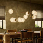 Featuring Armstrong Burnished Brass Marbled Matte Glass Linear Chandelier by Four Hands at Amethyst Home. Marbled glass spheres seem to extend and reach across smooth brass rods. Each globe is individually blown, shaped and sculpted by hand through a one-hour process. Brass and glass are 98% recyclable. Designed and sustainably made in Poland by Schwung.
Overal. Amethyst Home provides interior design, new home construction design consulting, vintage area rugs, and lighting in the Tampa metro area.