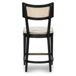 Featuring Britt Brushed Ebony with Savile Flax Stool by Four Hands at Amethyst Home. Mixed materials refresh retro styling. Brushed ebony nettlewood frames a textural inlay of natural cane for beautifully crisp contrast. Fastened by Velcro, light, linen-blend seating of high-performance fabric brings modern sensibility to the counter. Performance fabrics are s. Amethyst Home provides interior design, new home construction design consulting, vintage area rugs, and lighting in the Austin metro area.