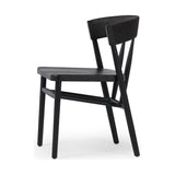 Featuring Buxton Black Oak Dining Chair by Four Hands at Amethyst Home. A solid oak dining chair defined by tapered legs and