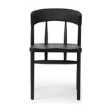 Featuring Buxton Black Oak Dining Chair by Four Hands at Amethyst Home. A solid oak dining chair defined by tapered legs and