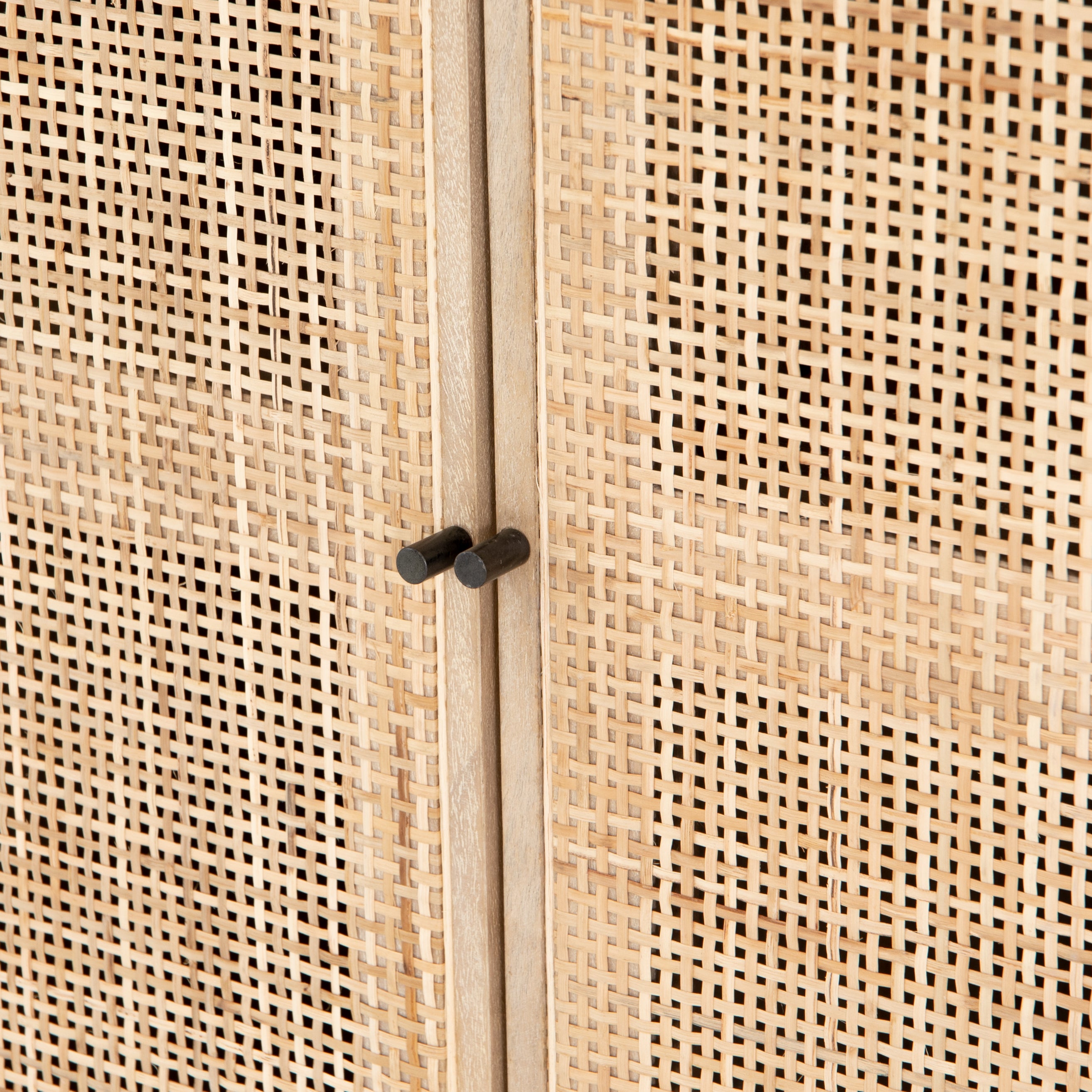 Featuring Carmel Natural Mango Small Cabinet by Four Hands at Amethyst Home. Mid-century style with an organic twist. Surrounded by mango casing, light cane weaves for a fresh look with natural depth. Angular gunmetal-finished iron legs offer an intriguing contrast of texture and tone. Perfect solo or paired up.Overall Dimensions: 35"W x 18"L x 32"HColors: Natural Cane, Natural Mango, Char. Amethyst Home provides interior design services, furniture, rugs, and lighting in the Des Moines metro area.