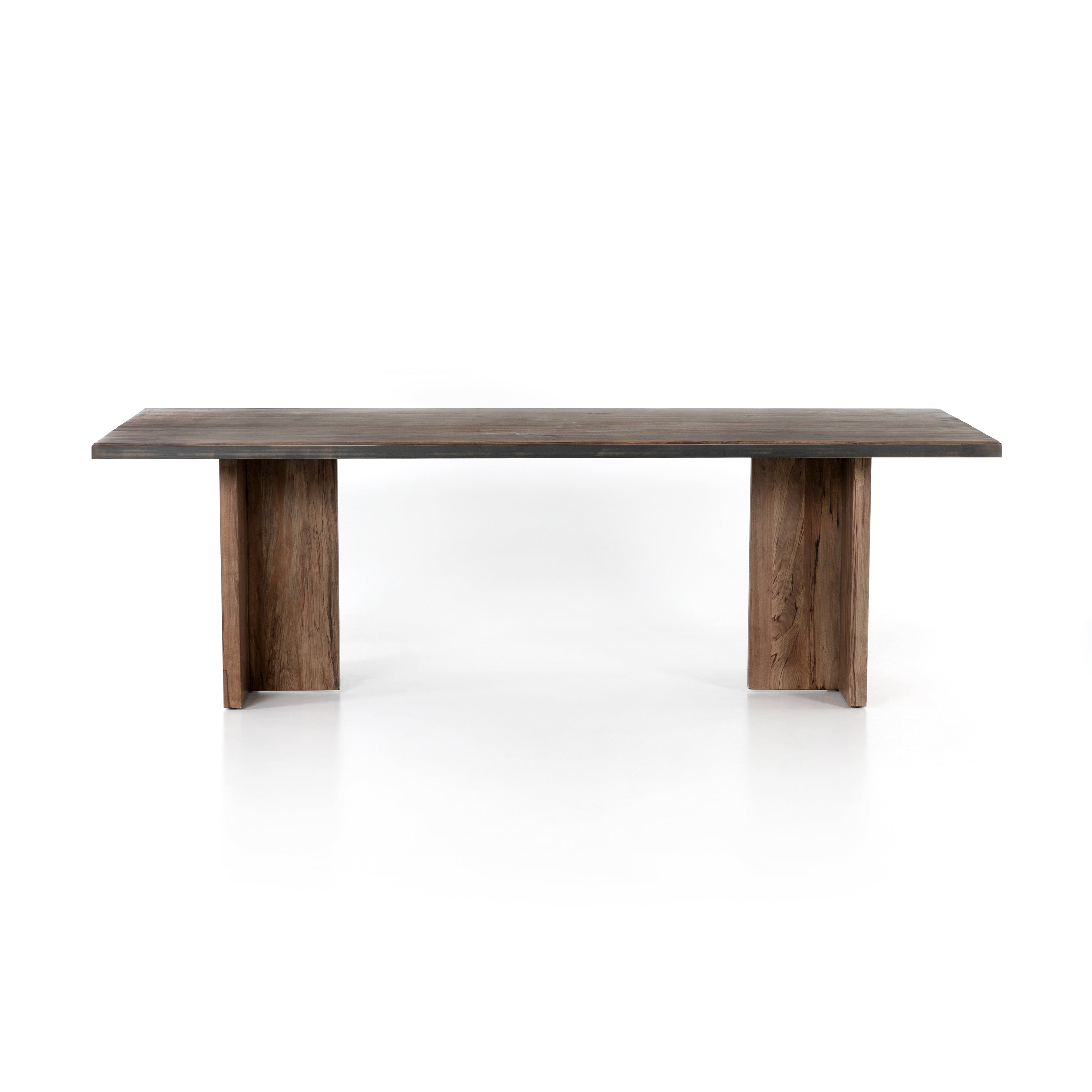 Featuring Cross Spalted Alder Dining Table by Four Hands at Amethyst Home. The Cross Spalted Alder Dining Table features an iron strapping with a brushed gold finish adds a rustic, industrial edge to a substantial plank table. Beautiful graining marks simple, cross-shaped trestles and table top.
Overall Dimensions: 94"W x 42"L x 30"HColors: Dark Spalte.  Amethyst Home provides interior design, new home construction design consulting, vintage area rugs, and lighting in the Newport Beach metro area.