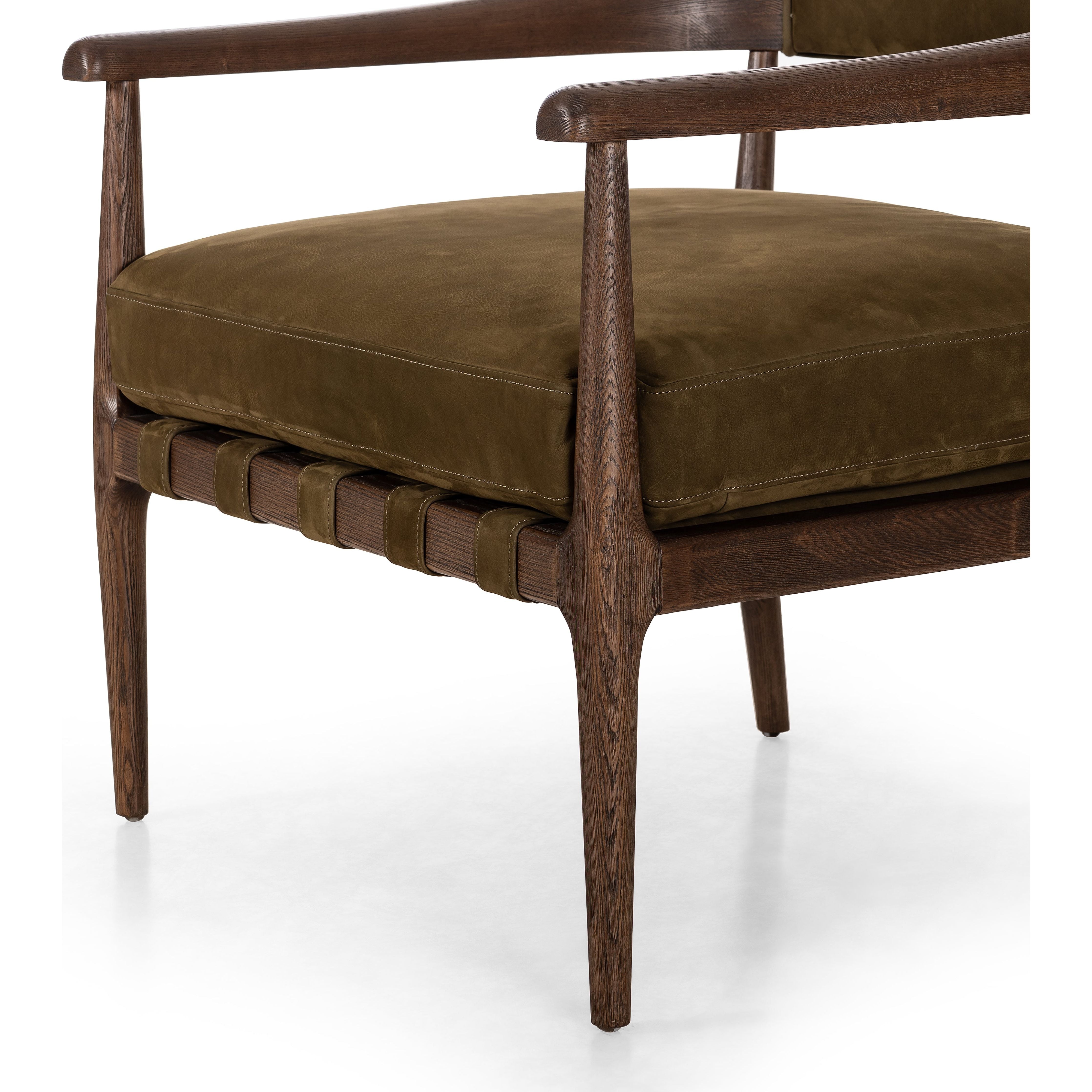 Featuring Dane Cottswald Moss Nubuck Chair by Four Hands at Amethyst Home. Safari styling is brought to modern speed on this vintage-inspired chair. Its solid wood frame features a webbed seating structure that brings a sink-in feel to the entire piece. The upholstered back, strap details and loose cushion are finished in a rich Italian-made leather with a soft, buttery feel and . Amethyst Home provides interior design, new construction, custom furniture, and area rugs in the Nashville metro area.