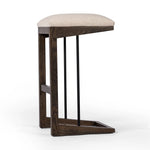 Featuring Finn Sienna Brown Oak Bar Stool by Four Hands at Amethyst Home. A stunner from every angle, this architecturally inspired stool features an angular base crafted from solid oak with two iron rods for added support and visual interest. Seat is upholstered in a linen/cotton/poly blend performance fabric with subtle texture throughout. Performance fab. Amethyst Home provides interior design, new home construction design consulting, vintage area rugs, and lighting in the Nashville metro area.