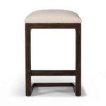 Featuring Finn Sienna Brown Oak Counter Stool by Four Hands at Amethyst Home. A stunner from every angle, this architecturally inspired stool features an angular base crafted from solid oak with two iron rods for added support and visual interest. Seat is upholstered in a linen/cotton/poly blend performance fabric with subtle texture throughout. Performance. Amethyst Home provides interior design, new home construction design consulting, vintage area rugs, and lighting in the Nashville metro area.