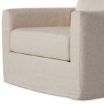 Featuring Hampton Creme Slipcover Swivel Chair by Four Hands at Amethyst Home. Proudly built by American makers using US-sourced materials and mechanisms. This classic swivel chair features clean track arms, a high, supportive back, feather filling and a 360-degree swivel. Upholstered with a fully removable slipcover of PFAS-free performance fabric that can b. Amethyst Home provides interior design, new home construction design consulting, vintage area rugs, and lighting in the Seattle metro area.