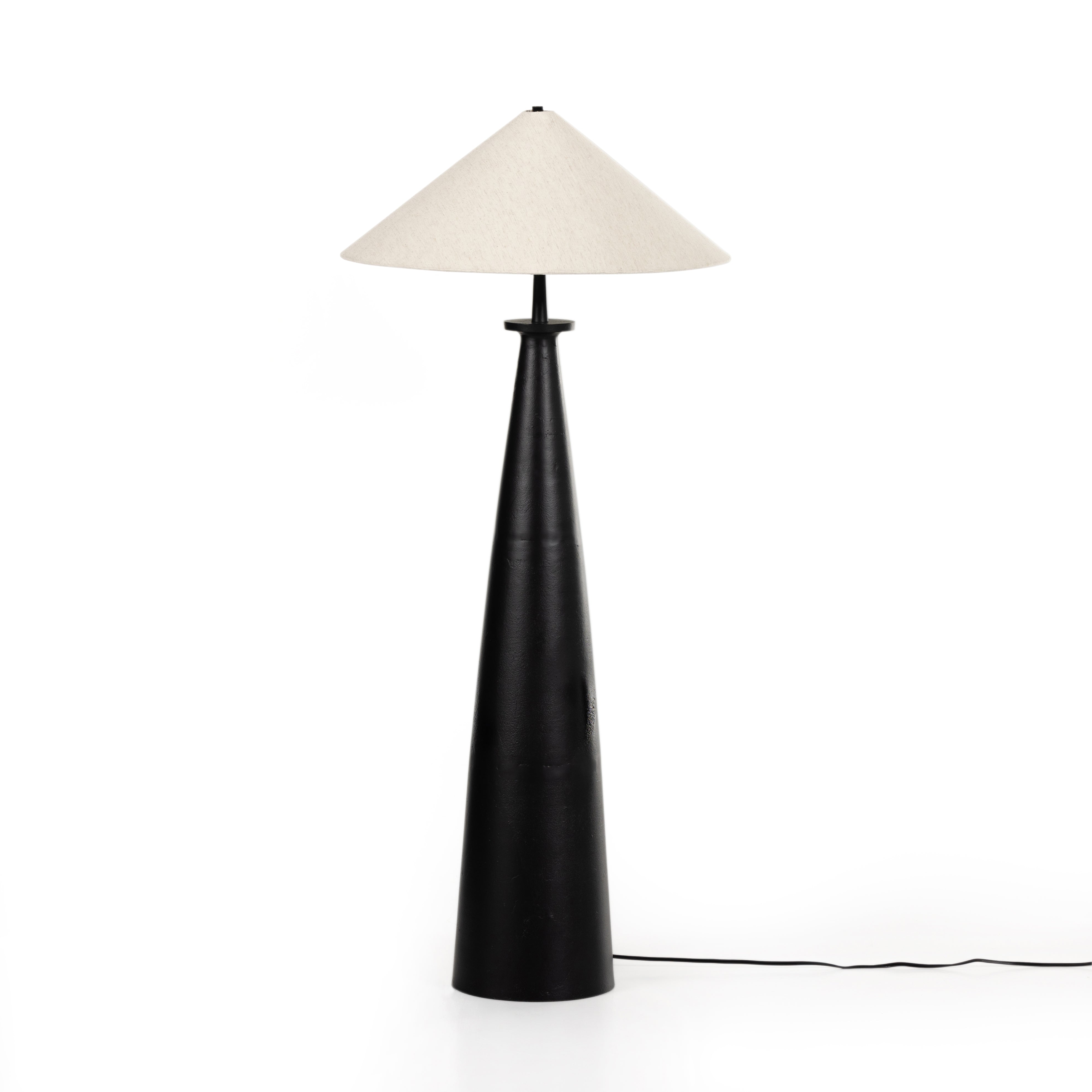 Featuring Innes Matte Black Tapered Shade Floor Lamp by Four Hands at Amethyst Home. A striking sculptural piece featuring a beautifully shaped base of textured black aluminum. Paired with a tapered 100% cotton shade for contrast.Overall Dimensions: 30"W x 30"L x 65.75"HColors: Matte Black Cast Aluminum, Black Cord, Light BeigeMaterials: Aluminum, Vacuum Thermo. Amethyst Home provides interior design, new home construction design consulting, vintage area rugs, and lighting in the Omaha metro area.