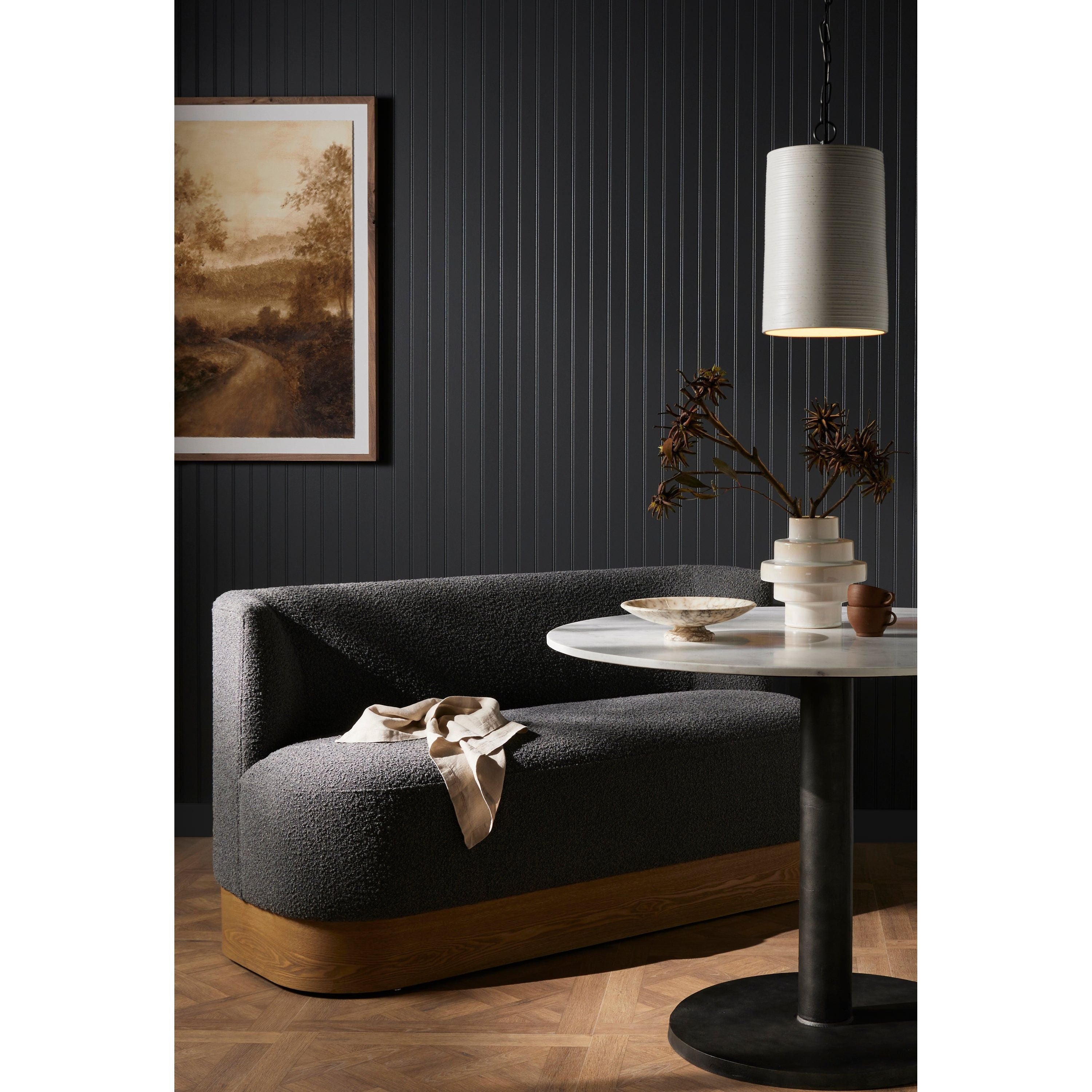 Featuring Krista Knoll Charcoal Dining Bench by Four Hands at Amethyst Home. Style takes shape. Comfortably curved bench seating is upholstered in a chunky charcoal boucle, with water-repellent high-performance fabric for modern sensibility. A plinth-style ash veneer base works casual contrast into the mix. Perfectly sized for a cozy breakfast nook; pai. Amethyst Home provides interior design, new home construction design consulting, vintage area rugs, and lighting in the Newport Beach metro area.
