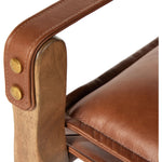 Featuring Lenz Sonoma Chestnut Dining Armchair by Four Hands at Amethyst Home. Inspired by a vintage safari-style frame, this dining chair is defined by the fluid strap arms. Semi-attached cushions in rich chestnut leather, finished with button tufting details. Parawood frame and brass details add warmth and texture.Overall Dimensions: 25"W x 23"L x 34"H. Amethyst Home provides interior design, new home construction design consulting, vintage area rugs, and lighting in the Laguna Beach metro area.