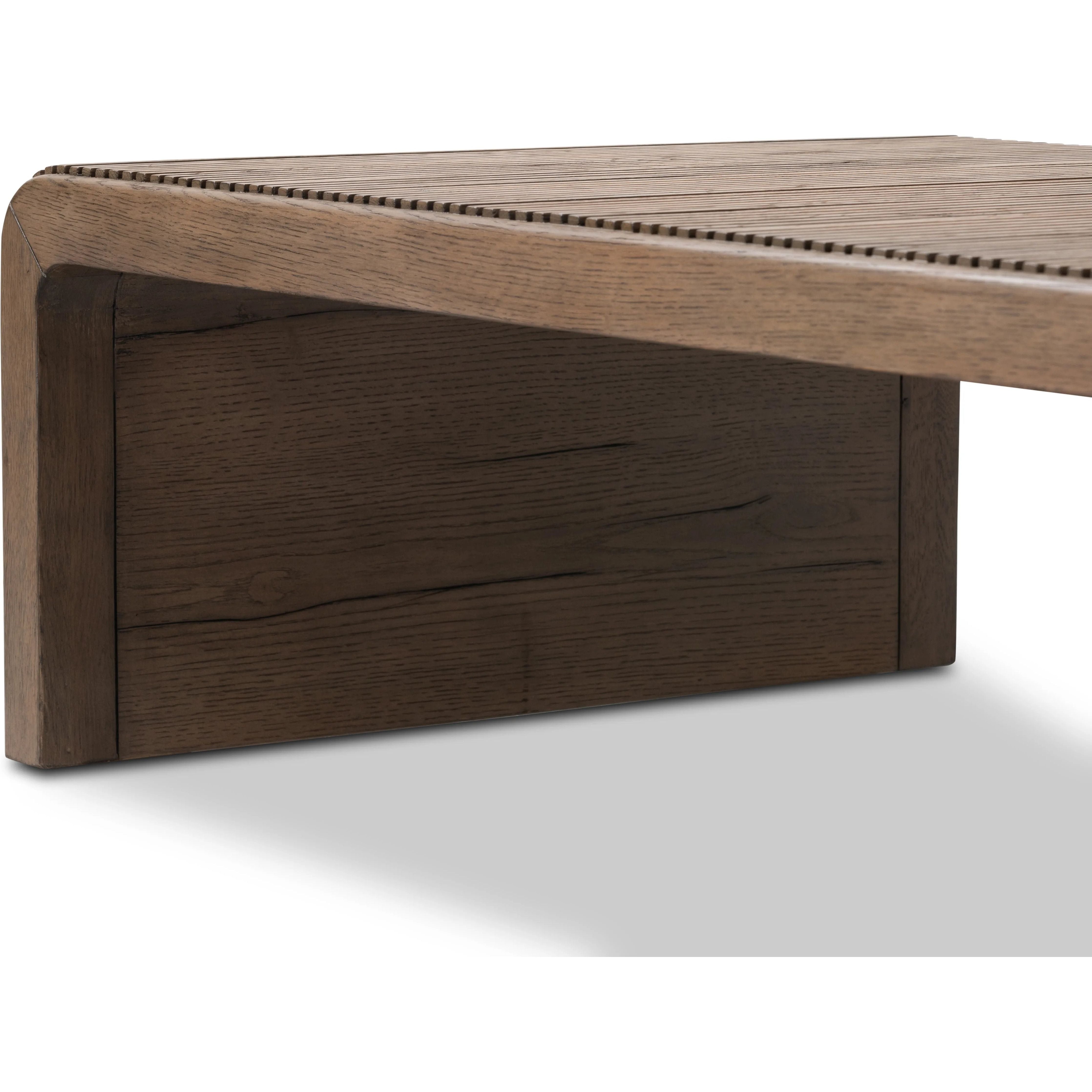 Featuring Leo Rustic Grey Coffee Table by Four Hands at Amethyst Home. Grey-finished oak shapes an elongated coffee table, rich with reeding. Subtly rounded edges reflect Brazilian midcentury inspiration behind this crafted minimalist piece. Designed in partnership with longtime Four Hands collaborator Thomas Bina and designer Ronald Sasson.Overall Dimensions:. Amethyst Home provides interior design, new home construction design consulting, vintage area rugs, and lighting in the Boston metro area.