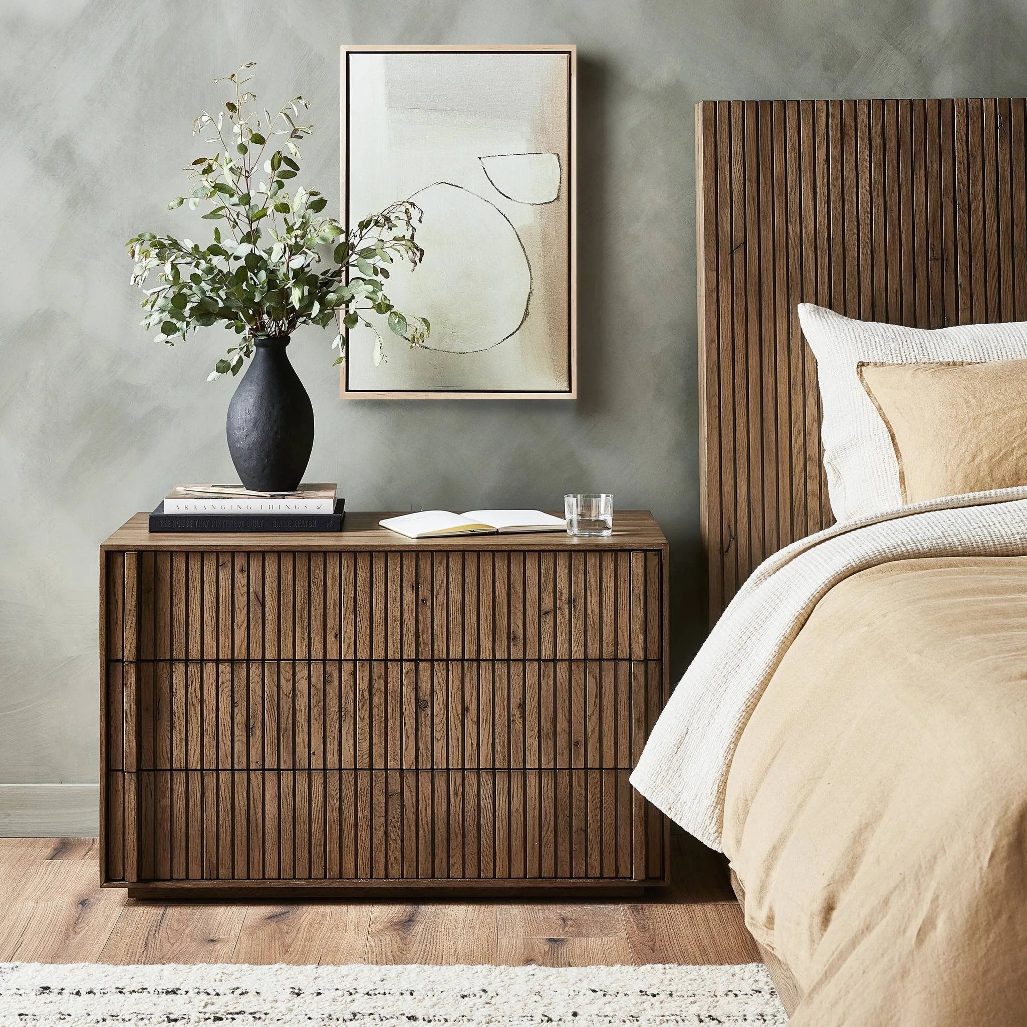 Featuring Leo Rustic Grey Nightstand by Four Hands at Amethyst Home. Designed by Thomas Bina and Ronald Sasson, a design partnership blending both modern minimalist and Brazilian influences. Crafted from solid oak, this clean-lined nightstand features vertical reed detailing on the drawer fronts with wooden pull detailing on the outer edges. Drawers are finishe. Amethyst Home provides interior design, new home construction design consulting, vintage area rugs, and lighting in the Tampa metro area.