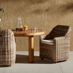 Featuring Messina Outdoor Dining Armchair by Four Hands at Amethyst Home. Traditional heritage shape on a grand scale. The outdoor dining chair is crafted from durable natural teak in a gorgeous, woven pattern highlighting the texture's natural highs and lows. Oversized with deep-seated comfort for the ultimate outdoor dining space. Cover or store indoors during inclement weather . Amethyst Home provides interior design, new construction, custom furniture and area rugs in the Washington metro area