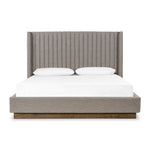 Featuring Montgomery Bed by Four Hands at Amethyst Home. The Montgomery Bed is a tall, vertical-channeled headboard that is upholstered in grey high-performance fabric for a sensible take on modern bedroom styling. A parawood plinth base grounds the whole look. Performance fabrics are specially created to withstand spills, stains, high traffic and wear, ensuring long-term comfort and unmatched. Amethyst Home provides interior design services, furniture, rugs, and lighting in the Dallas metro area.