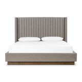 Featuring Montgomery Bed by Four Hands at Amethyst Home. The Montgomery Bed is a tall, vertical-channeled headboard that is upholstered in grey high-performance fabric for a sensible take on modern bedroom styling. A parawood plinth base grounds the whole look. Performance fabrics are specially created to withstand spills, stains, high traffic and wear, ensuring long-term comfort and unmatched. Amethyst Home provides interior design services, furniture, rugs, and lighting in the Dallas metro area.