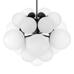 Featuring Nova Black Gunmetal Chandelier by Four Hands at Amethyst Home. Marbled glass spheres form an interstellar cluster around a matte black frame. Each globe is individually blown, shaped and sculpted by hand through a one-hour process. The finish on the pendant brass frame is achieved through a specialized process that turns the brass into an almost bl. Amethyst Home provides interior design, new home construction design consulting, vintage area rugs, and lighting in the Portland metro area.