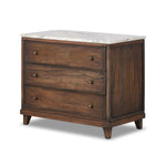 Featuring Odette Antique Belgium Bleach Marble Nightstand by Four Hands at Amethyst Home. Capturing the charm of vintage French storage, this solid mango wood nightstand stands tall with a polished marble top and softened ogee edges. Three spacious drawers are fitted with classic brass-button hardware. Natural marks and cracks are characteristic of the re. Amethyst Home provides interior design, new home construction design consulting, vintage area rugs, and lighting in the Kansas City metro area.