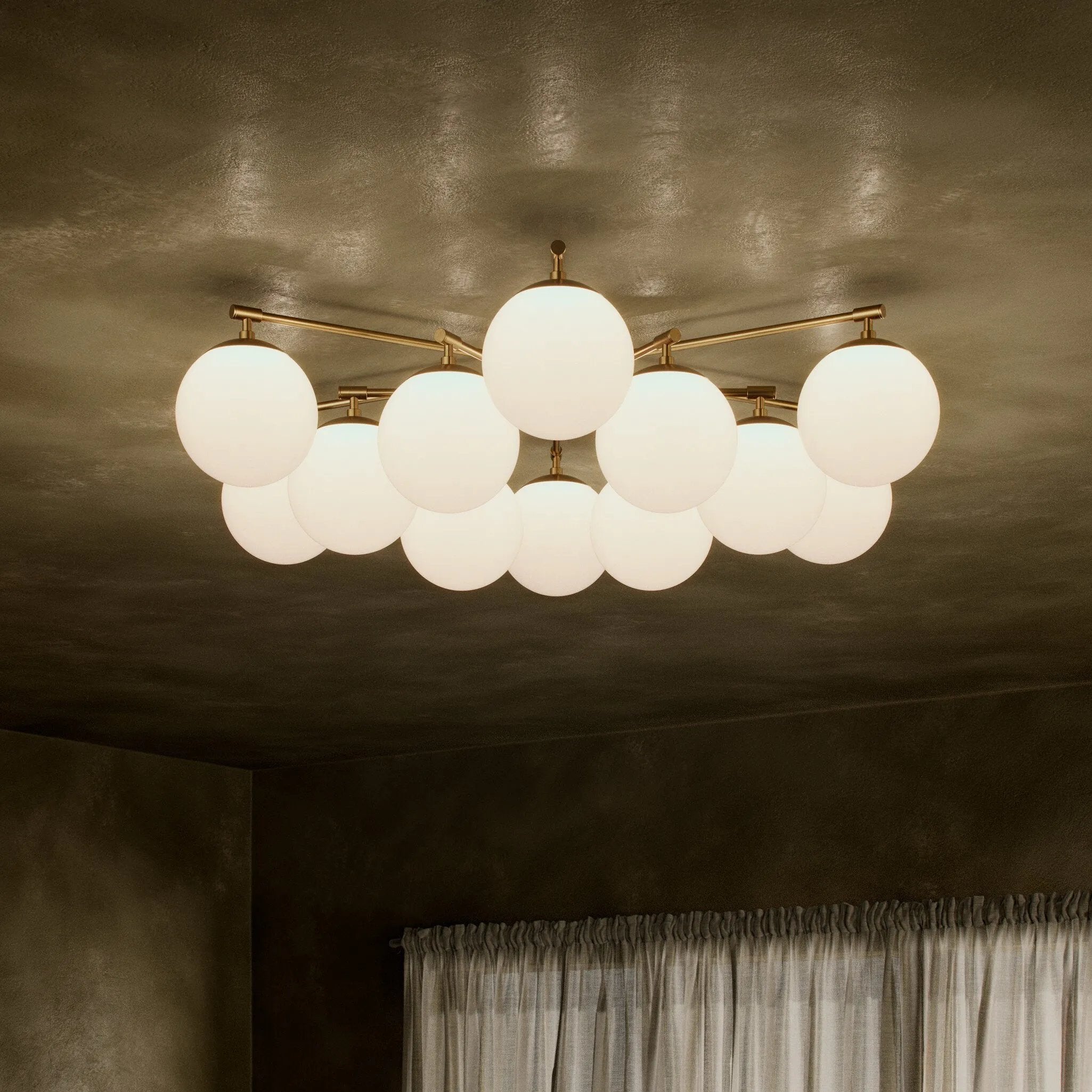 Featuring Orion Burnished Brass Round Chandelier by Four Hands at Amethyst Home. Matte glass spheres seem to extend and reach across smooth brass rods. Each globe is individually blown, shaped and sculpted by hand through a one-hour process. Matte globes are specially manufactured to evenly diffuse light. Brass and glass are 98% recyclable. Designed and s. Amethyst Home provides interior design, new home construction design consulting, vintage area rugs, and lighting in the Kansas City metro area.