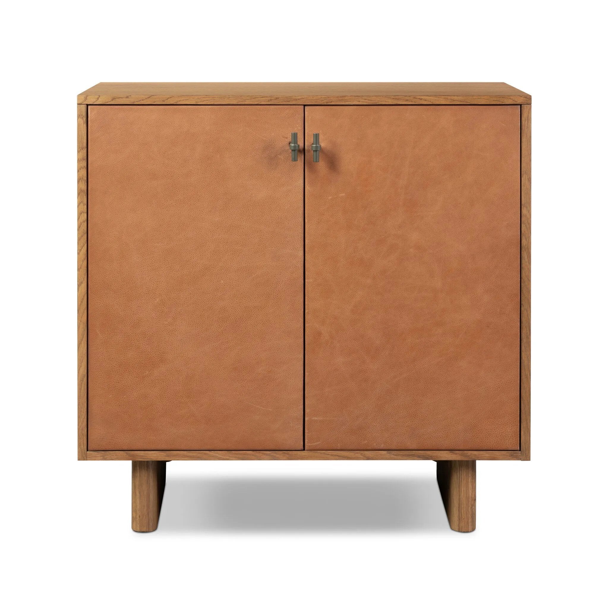 Featuring Posada Leather Small Cabinet by Four Hands at Amethyst Home. Smaller scale cabinetry of amber-finished oak, with door fronts of cognac top-grain leather and inset legs. Perfect for anywhere you need a bit of storage or pair with a large bed for nightstands!
Overall Dimensions: 18.0" L x 35.0 " W x 35.0" H
Collection: BoltonColors: Palermo Cog. Amethyst Home provides interior design, new home construction design consulting, vintage area rugs, and lighting in the Salt Lake City metro area.