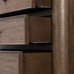 Featuring Russ Aged Oak Tall Dresser by Four Hands at Amethyst Home. Like an heirloom tallboy with six drawers, this aged oak dresser has room for it all. Detailed with an overhang surface, carved edges top to bottom, angled legs and oval drawer pulls finished in dark gunmetal.
Overall Dimensions: 21.0" L x 39.0 " W x 53.0" H
Collection: BoltonColors: Aged Oak. Amethyst Home provides interior design, new home construction design consulting, vintage area rugs, and lighting in the Boston metro area.
