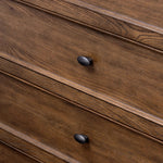 Featuring Russ Aged Oak Tall Dresser by Four Hands at Amethyst Home. Like an heirloom tallboy with six drawers, this aged oak dresser has room for it all. Detailed with an overhang surface, carved edges top to bottom, angled legs and oval drawer pulls finished in dark gunmetal.
Overall Dimensions: 21.0" L x 39.0 " W x 53.0" H
Collection: BoltonColors: Aged Oak. Amethyst Home provides interior design, new home construction design consulting, vintage area rugs, and lighting in the Dallas metro area.