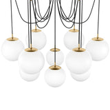 Featuring Spider Burnished Brass Opal Matte Glass Cord Chandelier by Four Hands at Amethyst Home. Matte glass spheres float at varying lengths for a statement-making piece. Each globe is individually blown, shaped and sculpted by hand through a one-hour process. Matte glass is specially manufactured to evenly diffuse light. Brass and glass are 98% recyclable. Amethyst Home provides interior design, new home construction design consulting, vintage area rugs, and lighting in the Monterey metro area.