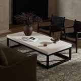 Featuring The Travertine Rectangular Coffee Table by Four Hands at Amethyst Home. Airy while substantial, for an intriguing balance of scale. Bronzed iron forms an open, angular frame for a rectangular tabletop of solid white travertine. By the makers at Van Thiel, known for their antique-inspired pieces and hand-applied finishes.Overall Dimensions: 33"W x 67". Amethyst Home provides interior design, new home construction design consulting, vintage area rugs, and lighting in the Dallas metro area.
