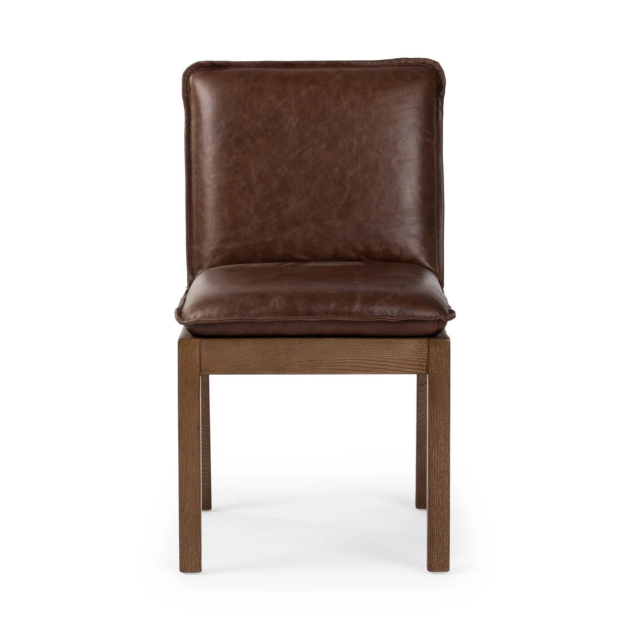 Featuring Wilmington Tan Oak Dining Chair by Four Hands at Amethyst Home. Inspired by the folded pillow form, the seat and back cushions of this oak dining chair are covered in brown top-grain leather. The chair back features leather strap details for a mixed material touch.Collection: AshfordColors: Tan Oak ,Havana BrownMaterials: Solid Oak ,Top Grain Lea. Amethyst Home provides interior design, new home construction design consulting, vintage area rugs, and lighting in the Alpharetta metro area.