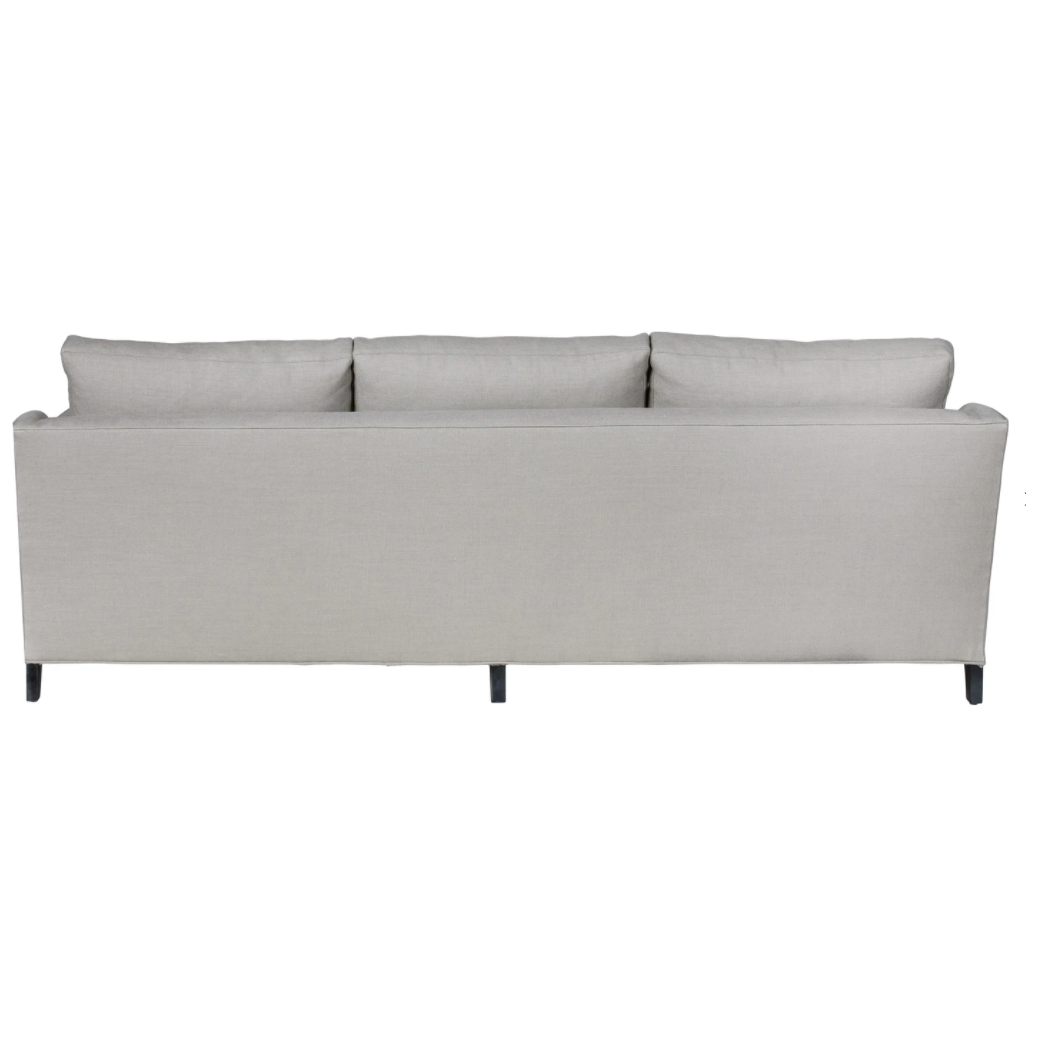 Featuring Gunner Upholstered 84" Sofa by Cisco Brothers at Amethyst Home. A chic, yet simple design, the Gunner Upholstered Sofa by Cisco Brothers boasts a streamlined frame supported by tapered legs. This sofa is beautifully detailed, with piping on the body and top stitch on cushions. It has a traditional yet sleek look, ideal for entertaining. Photo. Amethyst Home provides interior design, new home construction design consulting, vintage area rugs, and lighting in the Laguna Beach metro area.