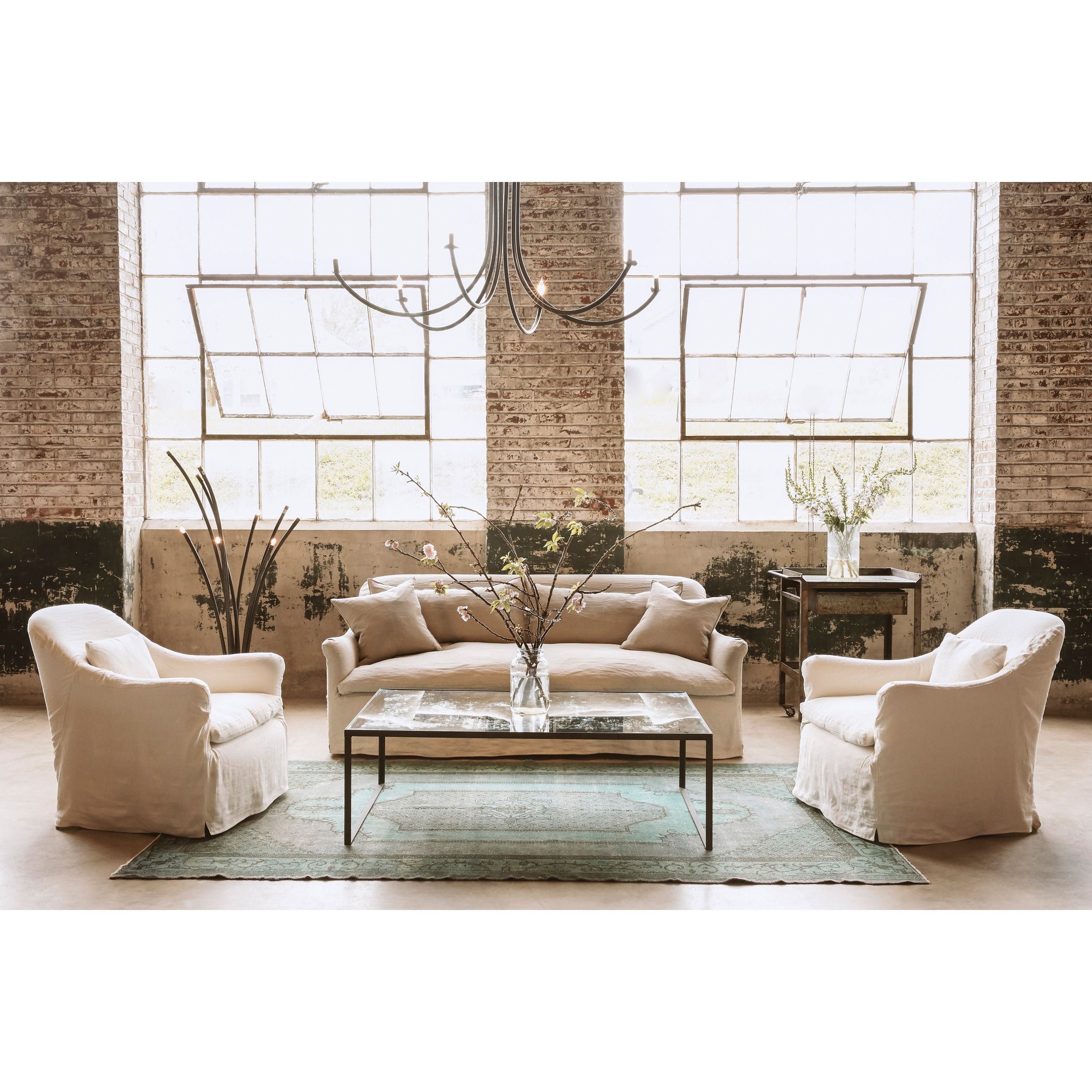 Featuring Hazel Sofa Family by Cisco Brothers at Amethyst Home. With pleats on the arms and a comfortable bench seat, the Hazel Sofa Family by Cisco Brothers effortlessly combines style and serenity. This sofa is guaranteed to make your living room look comfortable and cozy. Ideal spot to catch a breath during your weekday rush, or to enjoy a movie marathon d. Amethyst Home provides interior design, new home construction design consulting, vintage area rugs, and lighting in the Dallas metro area.