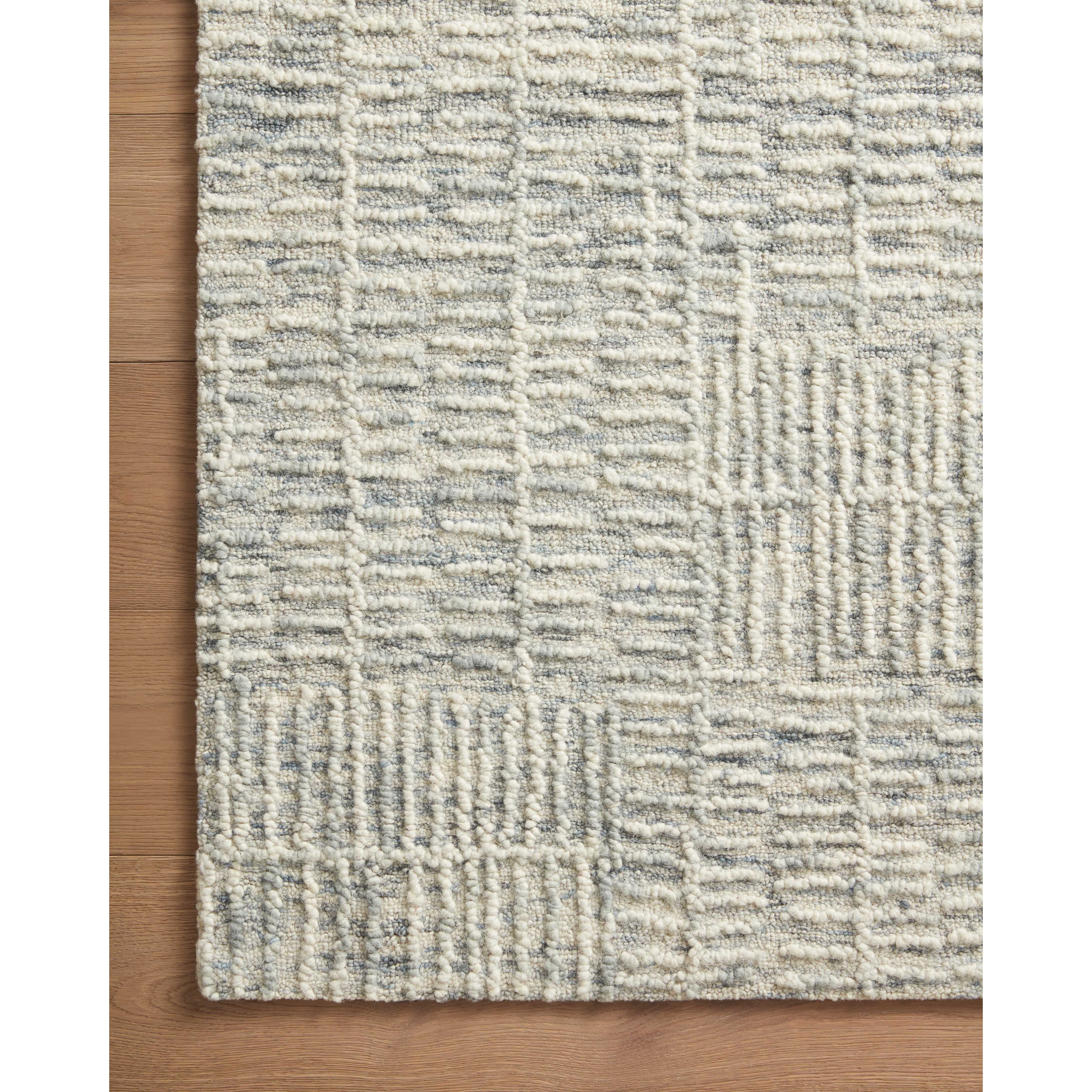 Featuring Tallulah Sky / Ivory Rug by Loloi at Amethyst Home. Hand-crafted with a combination of thick and fine yarns, the Tallulah Sky / Ivory Rug area rug creates dynamic dimension in living rooms, bedrooms, and more. The thicker yarns define the abstract, linear design, giving the rug a distinct high-low texture and sense of movement. Tallulah's soft, neutral palettes have a depth. Amethyst Home provides interior design, new construction, custom furniture, and area rugs in the Omaha metro area.