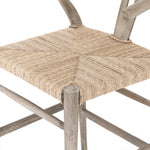 Featuring Muestra Counter + Bar Stool - Weathered Grey by Four Hands at Amethyst Home. Modern curves redefine the classic wishbone-style counter stool. Vintage white all-weather wicker is woven for a dose of fresh texture within weathered grey teak framing. Cover or store indoors during inclement weather and when not in use.
Counter Stool Overall Size: 21..  Amethyst Home provides interior design, new home construction design consulting, vintage area rugs, and lighting in the Charlotte metro area.