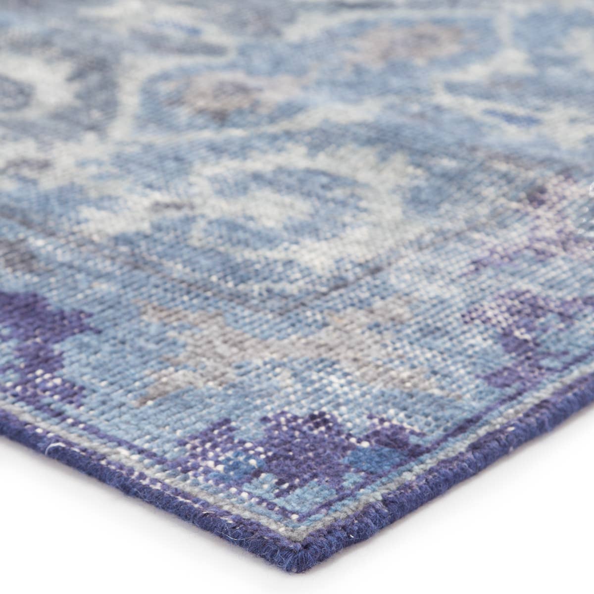 Featuring Kai Moonlight Blue Hand-Knotted Rug by Jaipur Living at Amethyst Home. When a traditional design motif is modernized and imbued with sophisticated shades of Moonlight Blue and Peacoat for a gently aged look, the result can only be called vintage chic. Modify from the new Kai Collection is hand-knotted in 100% wool for exceptional quality and an .  Amethyst Home provides interior design, new home construction design consulting, vintage area rugs, and lighting in the Alpharetta metro area.