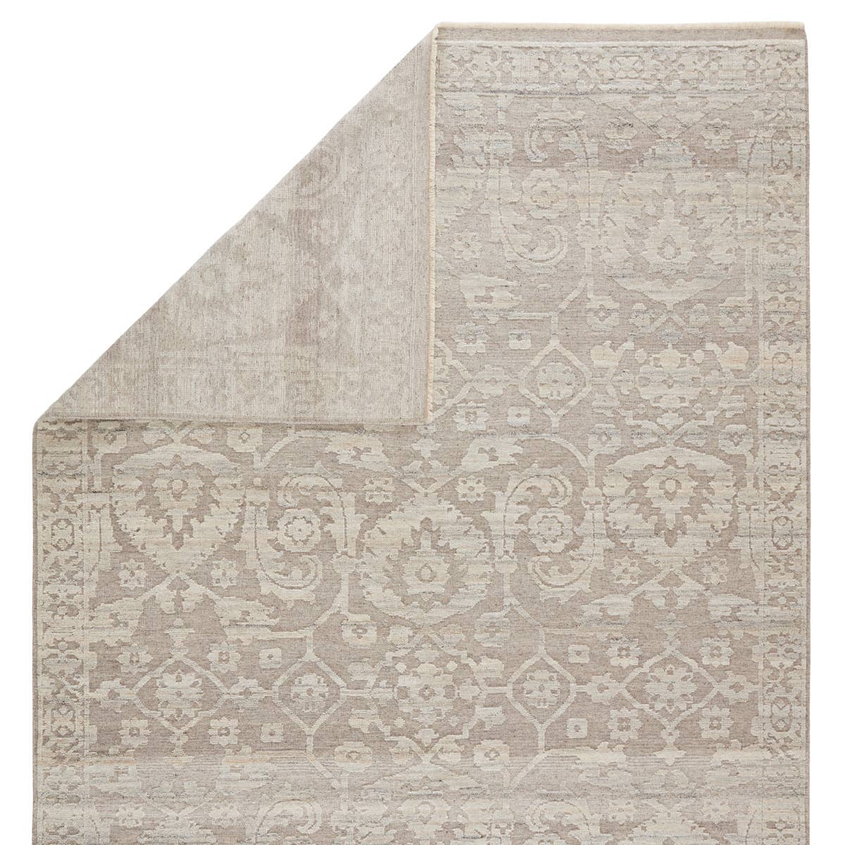 Featuring Sonnette Ayres Hand-Knotted Rug by Jaipur Living at Amethyst Home. The richly textured and elegantly designed Sonnette Ayres Area Rug combines an inviting, soft hand and eye-catching transitional style. The Ayres rug boasts a neutral palette of light taupe and gray that creates beautiful dimension among the brocade design. This hand-knotted wool.  Amethyst Home provides interior design, new home construction design consulting, vintage area rugs, and lighting in the Alpharetta metro area.