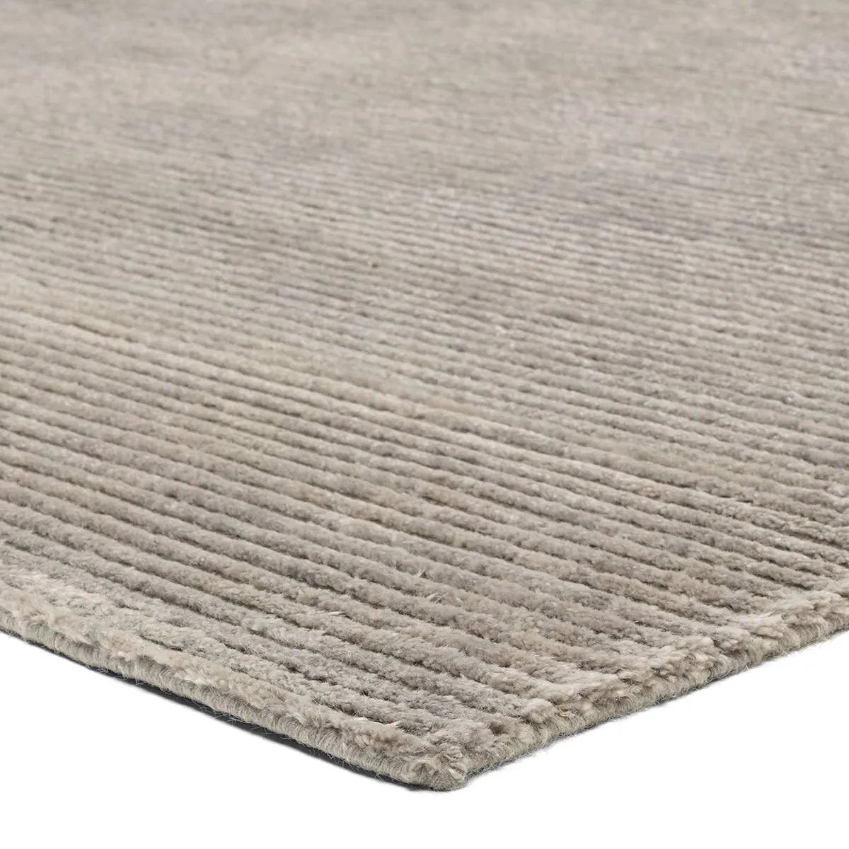 Featuring Aion Atropos Hand-Knotted Rug by Jaipur Living at Amethyst Home. Indulge in the epitome of luxe with the Aion Atropos, where the extraordinary softness of Cashmere meets the enduring durability of New Zealand Wool. Crafted to redefine the essence of sophistication, the silver Tibetan knotted Atropos design emerges as the unparalleled centerpiece in lo. Amethyst Home provides interior design, new home construction design consulting, vintage area rugs, and lighting in the Miami metro area.