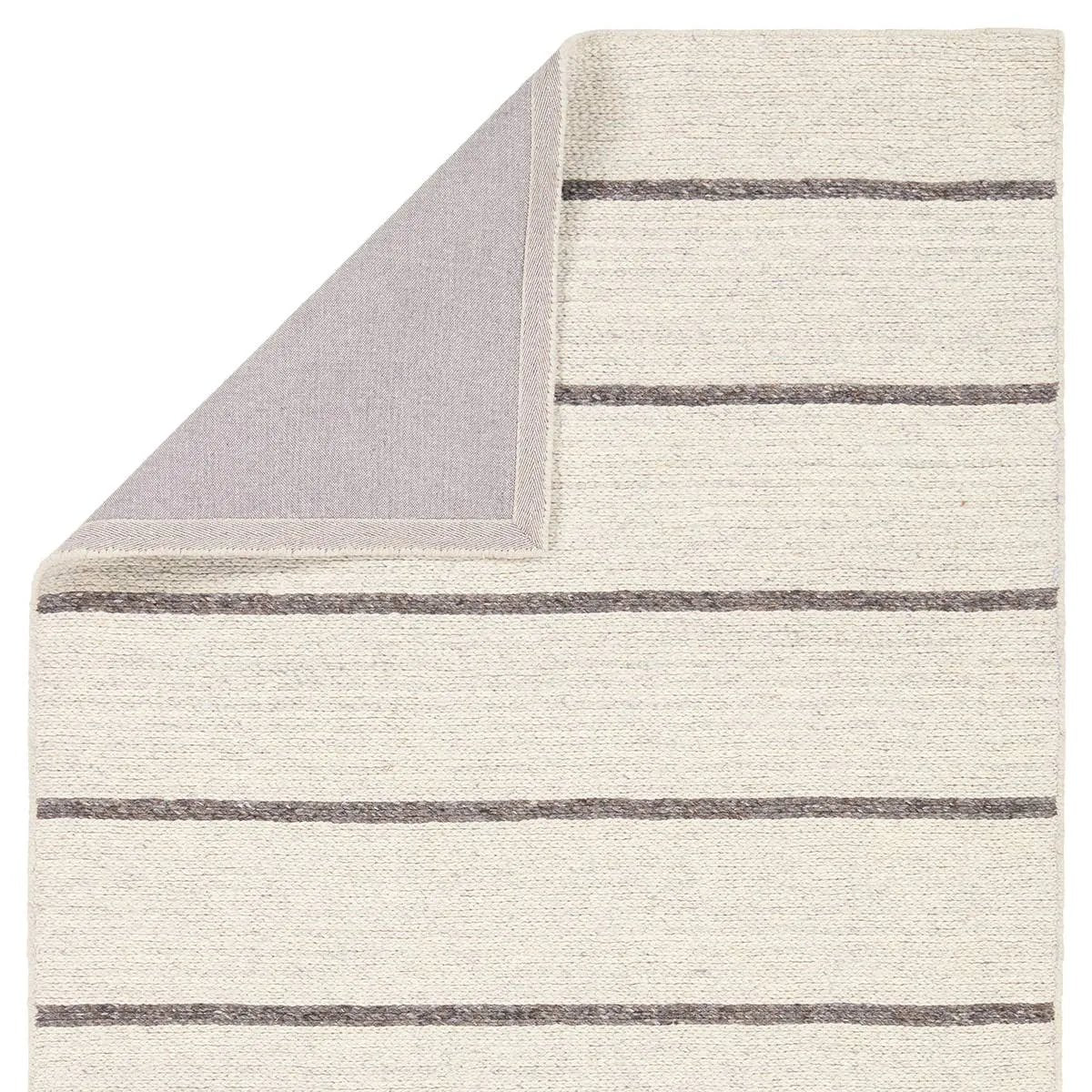 Featuring Bavell Almeda Rug by Jaipur Living at Amethyst Home. With its mesmerizing waves of 100% premium undyed artisanal wool, Norfolk adds an earthy, elemental ease to any modern interior. In unique combinations of creams and browns, the weaver’s impromptu selection of undyed yarn results in unexpected flecks of gray. Enjoy effortless style, and unsurpa. Amethyst Home provides interior design, new home construction design consulting, vintage area rugs, and lighting in the Scottsdale metro area.