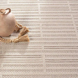 Featuring Continuum Quantum Rug by Jaipur Living at Amethyst Home. The Continuum collection brings the classic sisal look to outdoor spaces and high-traffic indoor areas. The soft Axiom design features an abstract, geometric pattern with cream high-low pile for added dimension. The polypropylene fibers are stain and water resistant for an easy-care accent pi. Amethyst Home provides interior design, new home construction design consulting, vintage area rugs, and lighting in the Monterey metro area.