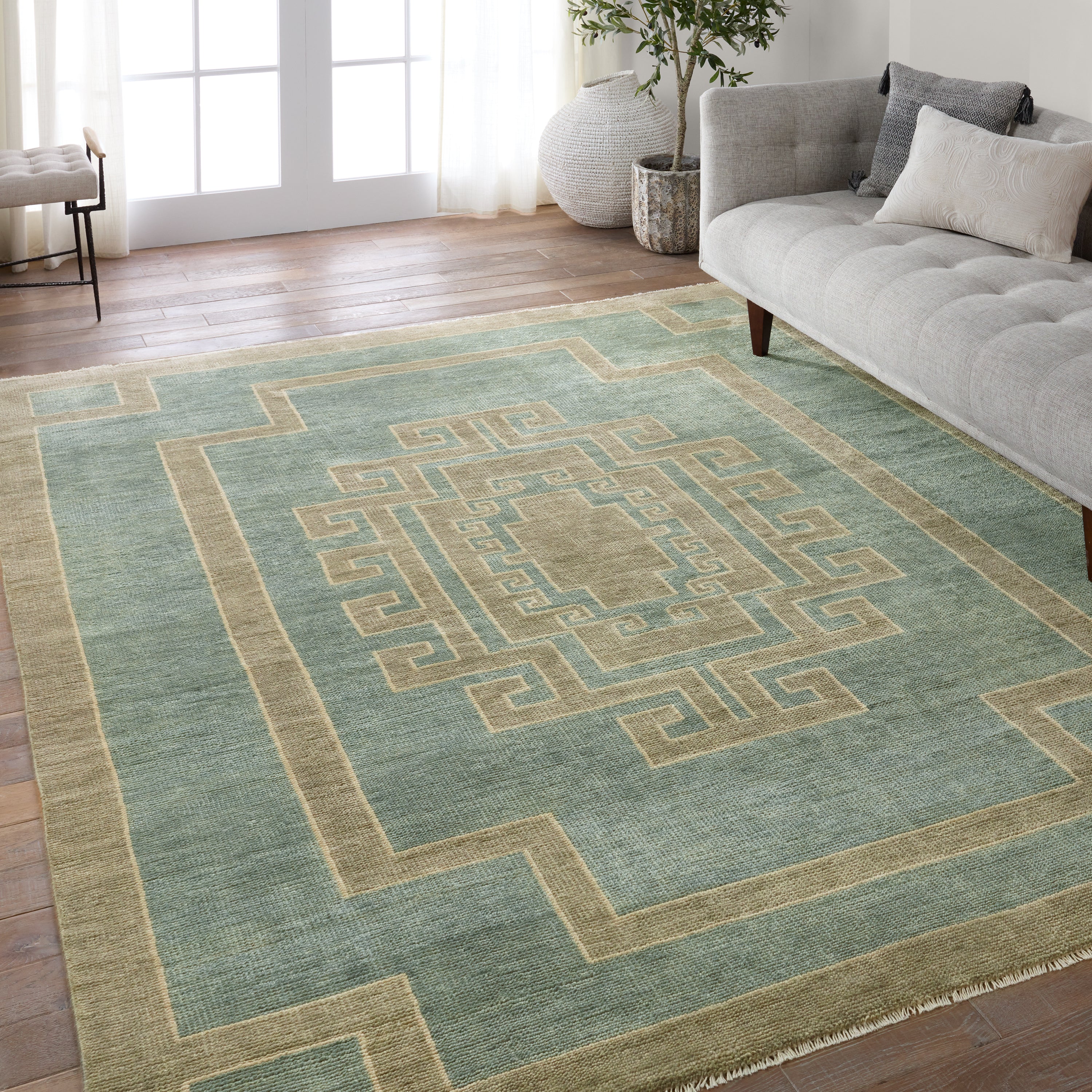 Featuring Cyprus Kyrenia Blue Hand-Knotted Rug by Jaipur Living at Amethyst Home. The hand-knotted Cyprus collection showcases a modern representation of vintage Kars designs with clean-lined geometric details and fresh colorways. The blue, sage, and cream Kyrenia design delights with an antique medallion pattern and a similarly styled border. Low pile and naturally stain resista. Amethyst Home provides interior design, new construction, custom furniture, and area rugs in the San Diego metro area.