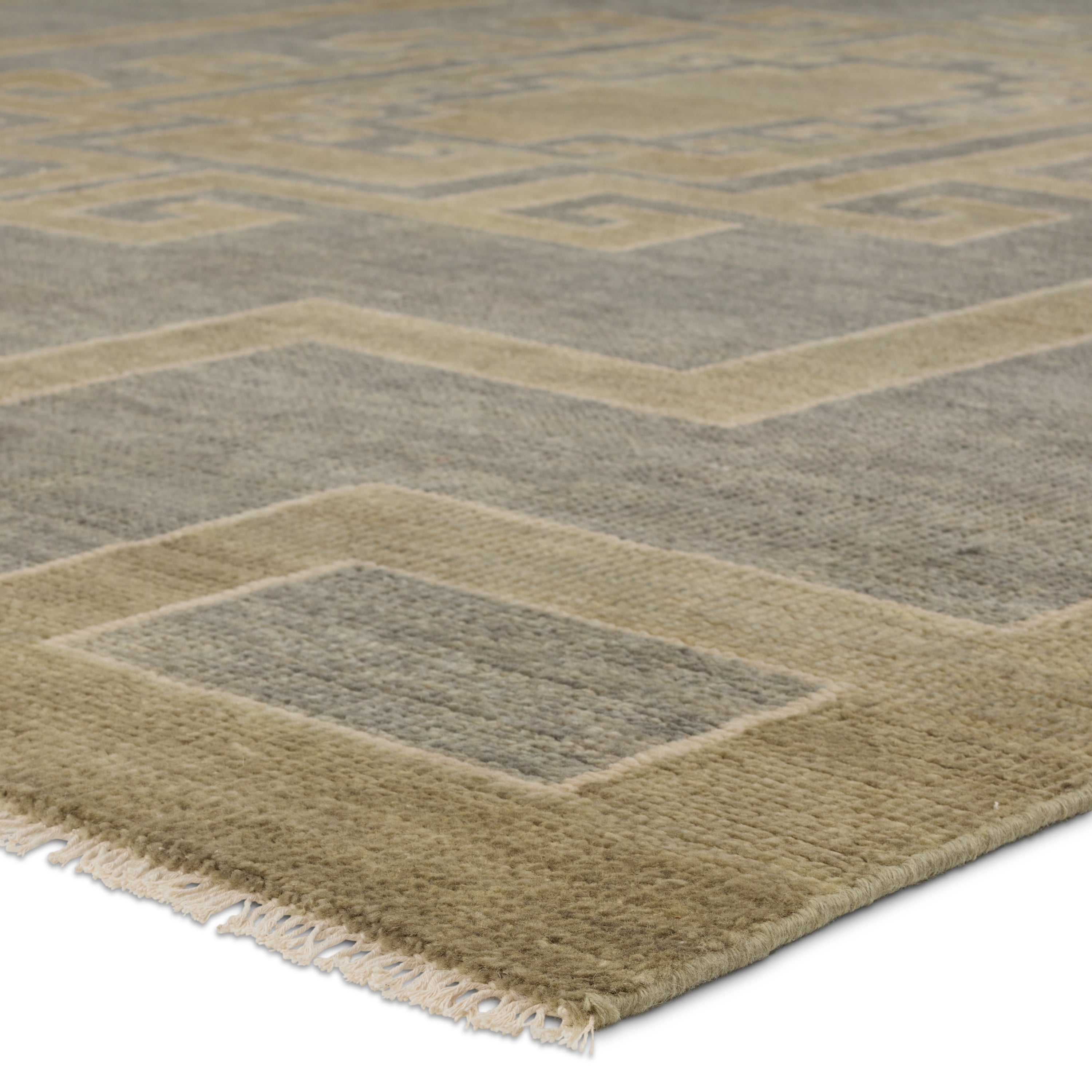 Featuring Cyprus Gray Kyrenia Hand-Knotted Rug by Jaipur Living at Amethyst Home. The hand-knotted Cyprus collection showcases a modern representation of vintage Kars designs with clean-lined geometric details and fresh colorways. The gray, sage, and cream Kyrenia design delights with an antique medallion pattern and a similarly styled border. Low pile and naturally stain resistant f. Amethyst Home provides interior design, new construction, custom furniture, and area rugs in the Omaha metro area.