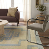 Featuring Cyprus Nicosia Asparagus Hand-Knotted Rug by Jaipur Living at Amethyst Home. The hand-knotted Cyprus collection showcases a modern representation of vintage Kars designs with clean-lined geometric details and fresh colorways. The blue, cream, gray, and caramel colored Nicosia design delights with a minimalistic medallion pattern and multiple borders. Low pile and naturally. Amethyst Home provides interior design, new construction, custom furniture, and area rugs in the Austin metro area.