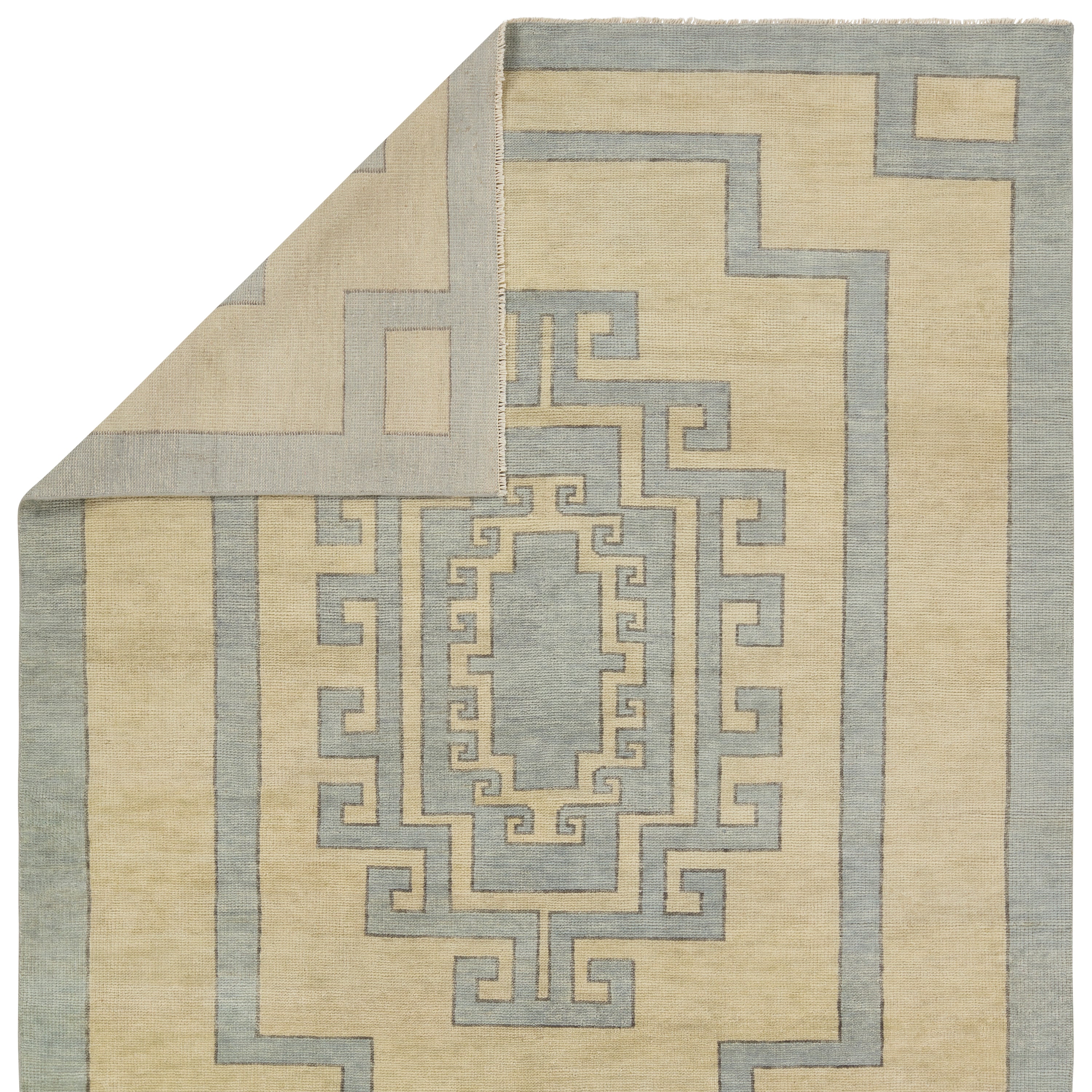 Featuring Cyprus Nicosia Asparagus Hand-Knotted Rug by Jaipur Living at Amethyst Home. The hand-knotted Cyprus collection showcases a modern representation of vintage Kars designs with clean-lined geometric details and fresh colorways. The blue, cream, gray, and caramel colored Nicosia design delights with a minimalistic medallion pattern and multiple borders. Low pile and natur. Amethyst Home provides interior design, new construction, custom furniture, and area rugs in the Des Moines metro area.