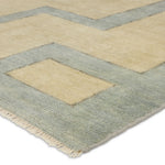 Featuring Cyprus Nicosia Asparagus Hand-Knotted Rug by Jaipur Living at Amethyst Home. The hand-knotted Cyprus collection showcases a modern representation of vintage Kars designs with clean-lined geometric details and fresh colorways. The blue, cream, gray, and caramel colored Nicosia design delights with a minimalistic medallion pattern and multiple borders. Low pile and naturally . Amethyst Home provides interior design, new construction, custom furniture, and area rugs in the Tampa metro area.