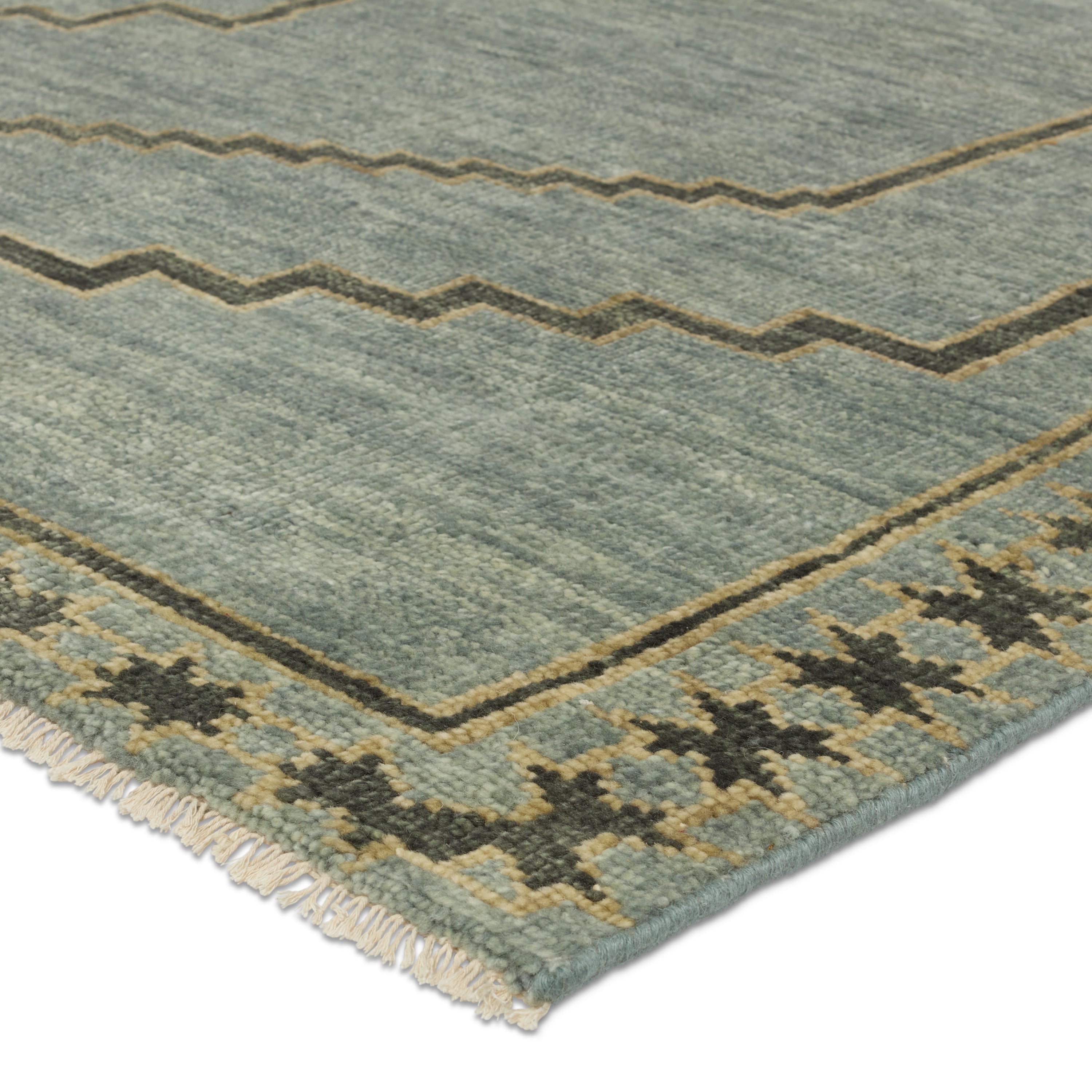 Featuring Cyprus Paphos Hand-Knotted Rug by Jaipur Living at Amethyst Home. The hand-knotted Cyprus collection showcases a modern representation of vintage Kars designs with clean-lined geometric details and fresh colorways. The blue, gray and sage green Paphos design delights with a minimalistic medallion pattern and a similarly styled border. Low pile and naturally stain resistant . Amethyst Home provides interior design, new construction, custom furniture, and area rugs in the Omaha metro area.