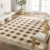 Featuring Desouk Berkshire Hand-Knotted Rug by Jaipur Living at Amethyst Home. The Desouk Berkshire melds modern allure with the global vibes of Morocco. The Berkshire hand-knotted rug showcases a geometric grid pattern with contrasting brown, cream, and tan tones. This handcrafted rug boasts plush, cut wool pile that pairs beautifully with braided tass. Amethyst Home provides interior design, new home construction design consulting, vintage area rugs, and lighting in the Newport Beach metro area.