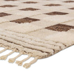 Featuring Desouk Berkshire Hand-Knotted Rug by Jaipur Living at Amethyst Home. The Desouk Berkshire melds modern allure with the global vibes of Morocco. The Berkshire hand-knotted rug showcases a geometric grid pattern with contrasting brown, cream, and tan tones. This handcrafted rug boasts plush, cut wool pile that pairs beautifully with braided tassel . Amethyst Home provides interior design, new home construction design consulting, vintage area rugs, and lighting in the Scottsdale metro area.